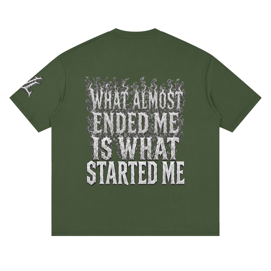 Back view of army green WHYELUME What Started Me drop shoulder tee with white smoke What Almost Ended Me Is What Started Me graphic