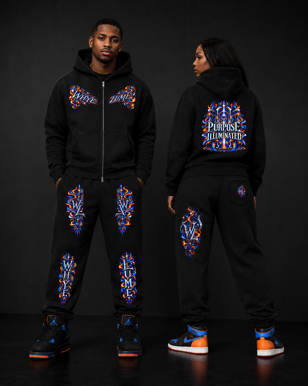 Man and woman wearing black WHYELUME Purpose Illuminated sweatpants and matching hoodies