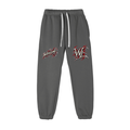Front view of cement gray WHYELUME Purpose Illuminated essential fleece sweatpants with red WHYELUME script and WL hip graphics