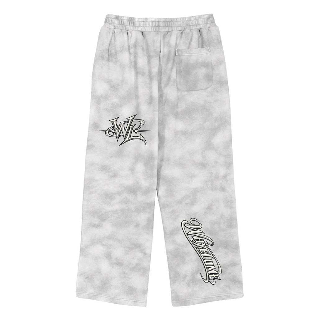 Back view of flower gray WHYELUME Purpose Illuminated dirty washed fleece sweatpants with black WHYELUME script leg graphic