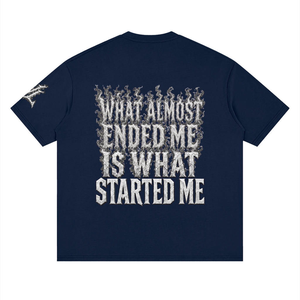 Back view of navy blue WHYELUME What Started Me drop shoulder tee with white smoke What Almost Ended Me Is What Started Me graphic