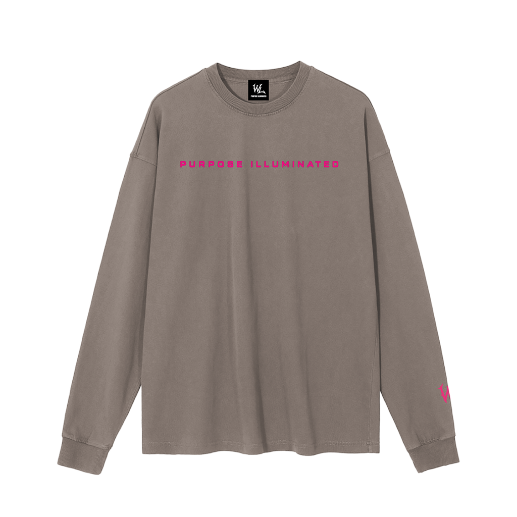Front view of brown WHYELUME Chrome Stack washed long sleeve tee with pink Purpose Illuminated chest text