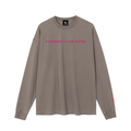 Front view of brown WHYELUME Chrome Stack washed long sleeve tee with pink Purpose Illuminated chest text