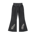 Front view of washed black WHYELUME Purpose Illuminated vintage washed flared fleece pants with white swirl graphics on both legs