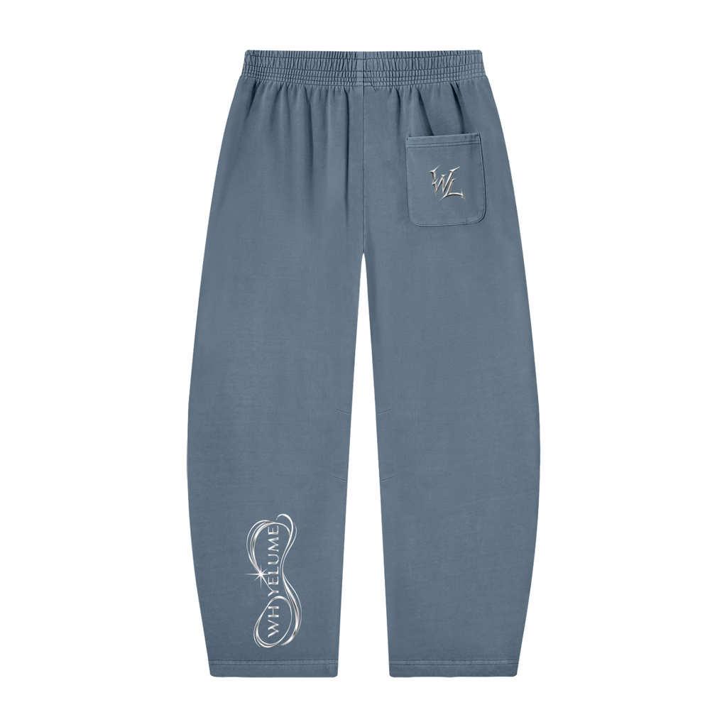 Back view of gray blue WHYELUME Purpose Illuminated barrel-leg sweatpants with white WL pocket mark and lower leg graphic
