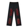 Front view of black WHYELUME Poured Empty sweatpants with red vertical Reclaim Yourself graphics down both legs