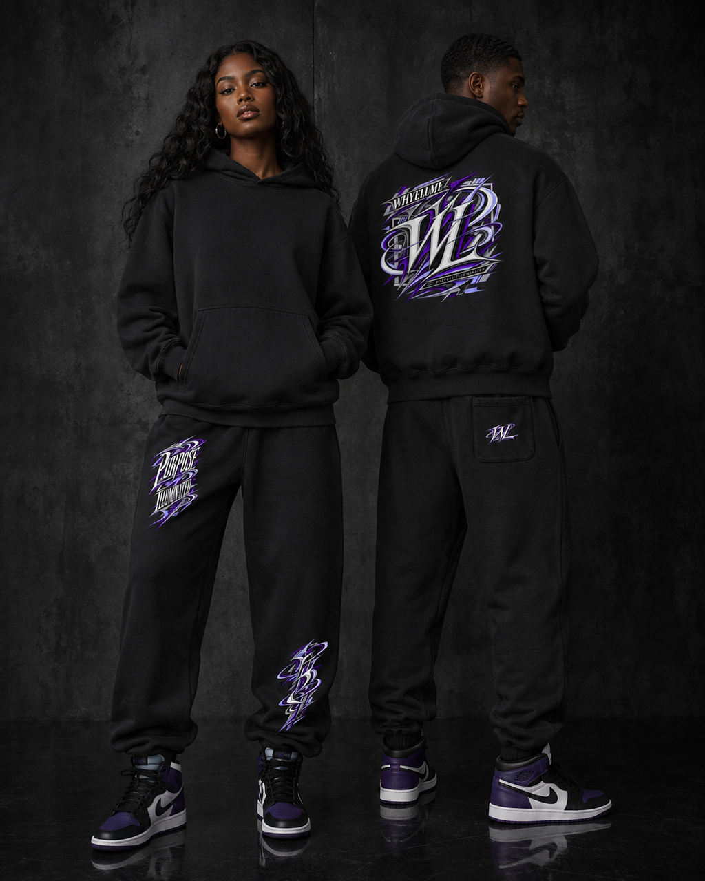 Man and woman wearing WHYELUME Purpose Illuminated purple graphic boxy hoodies and matching sweatpants