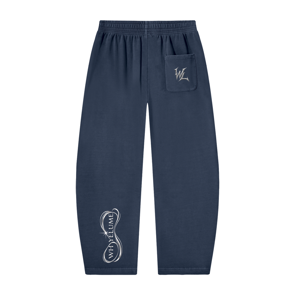 Back view of navy blue WHYELUME Purpose Illuminated barrel-leg sweatpants with white WL pocket mark and lower leg graphic